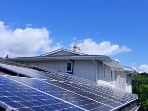 "Solar panels on a home roof reducing energy bills and increasing savings with renewable energy, optimized for Nova Scotia homeowners."